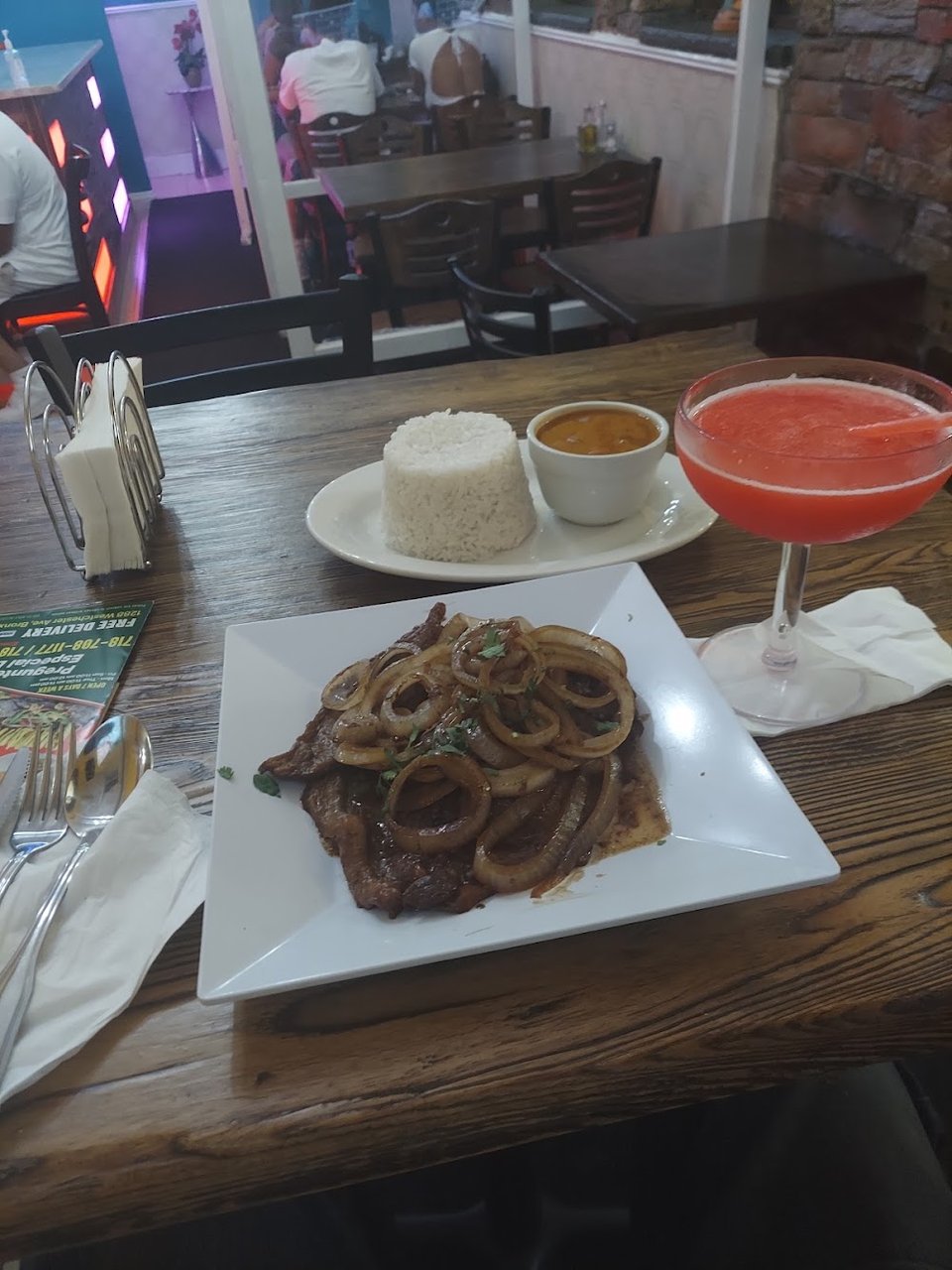 Bistec Encebollado with Rice and Beans